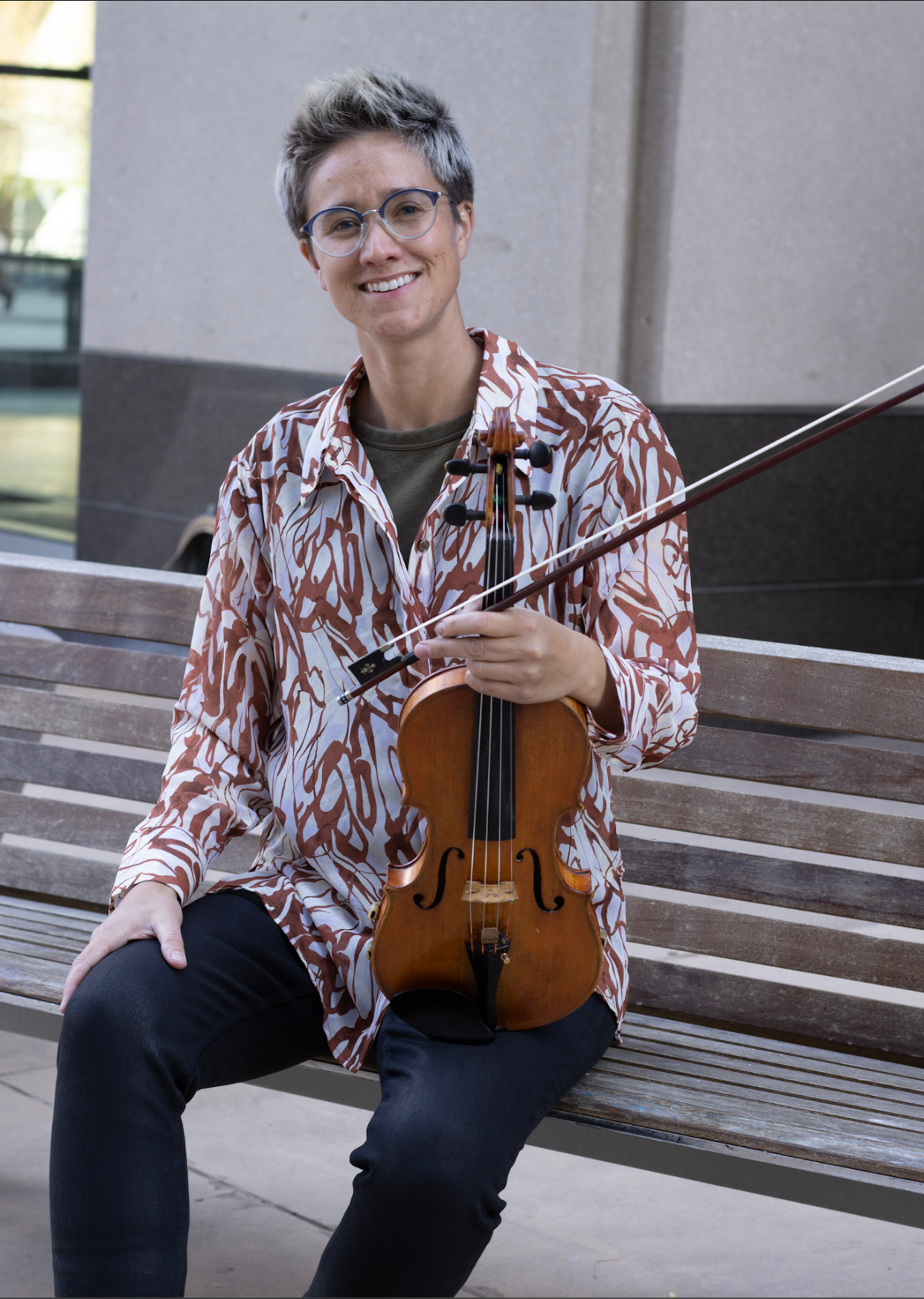 Rae McGee holding a violin